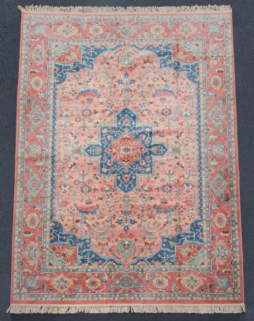 LARGE PINK GROUND SERAPI AREA RUG, 14: Karastan (American, founded 1928). Contemporary machine woven wool 'Medallion Serapi' carpet, design number 736. Label to the underside. Approx. 14' 2" x 10' 1"