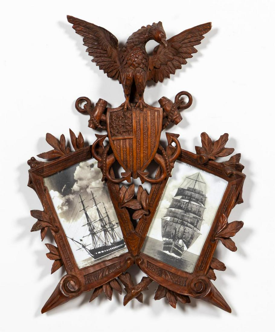 CARVED WOOD NAUTICAL FRAME, UNITED STATES NAVY: American, 19th/early 20th century. Wood carved hanging double photograph frame depicting stylized version of the United States Navy's logo with eagle atop flag shield and crossed anchors. Currently ho