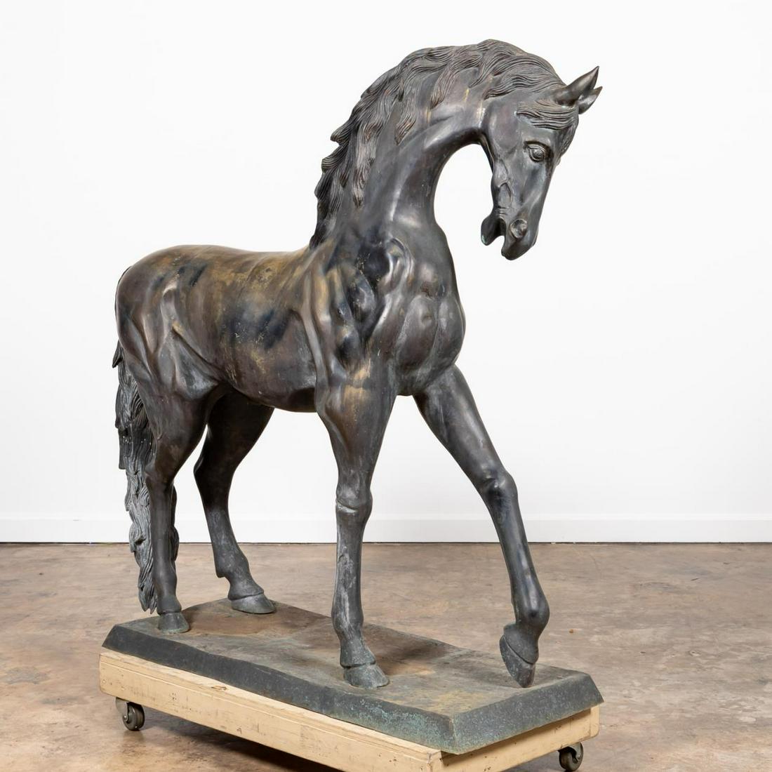 LARGE BRONZE OUTDOOR SCULPTURE OF A STANDING HORSE: Possibly Continental, 20th century. Large bronze sculpture of a well modeled muscular horse with one leg raised, on a rectangular base. Unmarked. Approx. h. 62.5”, w. 58”, d. 20.5”.