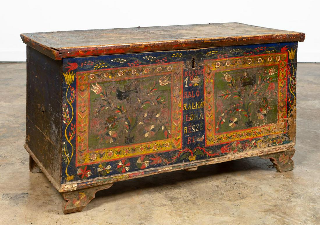 HUNGARIAN POLYCHROME WOOD BLANKET CHEST: Hungarian, early 20th century. Polychrome painted pine blanket chest with inscription and 1928 to front. Apparently unmarked. Approx. h. 25.625", w. 48.5", d. 22.625".