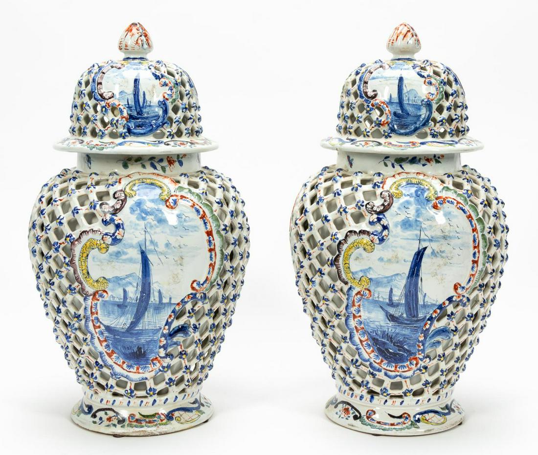 PAIR, DELFT RETICULATED SEASCAPE MOTIF LIDDED URNS: Delft, likely 17th century. Early tin glazed earthenware lidded urns with reticulated decoration and seascape scene. AR maker's mark to underside. Provenance: Acquired from Niall Smith Antiques in New