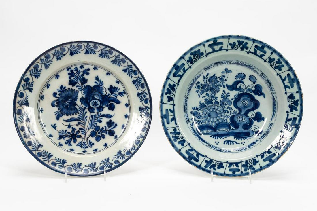 DELFT TABLEWARES, BLUE AND WHITE PLATTERS, 18TH C: Delft, likely 18th century. Two blue and white tableware pieces, large shallow bowls with floral decoration. Apparently unmarked. Approx. dia. 14"