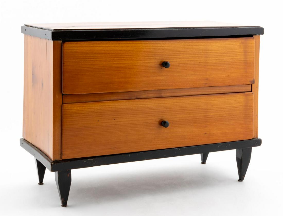 BIEDERMEIER STYLE FRUITWOOD MINIATURE CHEST: Late 19th / early 20th century. Biedermeier style salesman sample chest of drawers with ebonized wood and fruitwood and raised on tapered legs. Apparently unmarked. Provenance: Acquired from Niall Smi