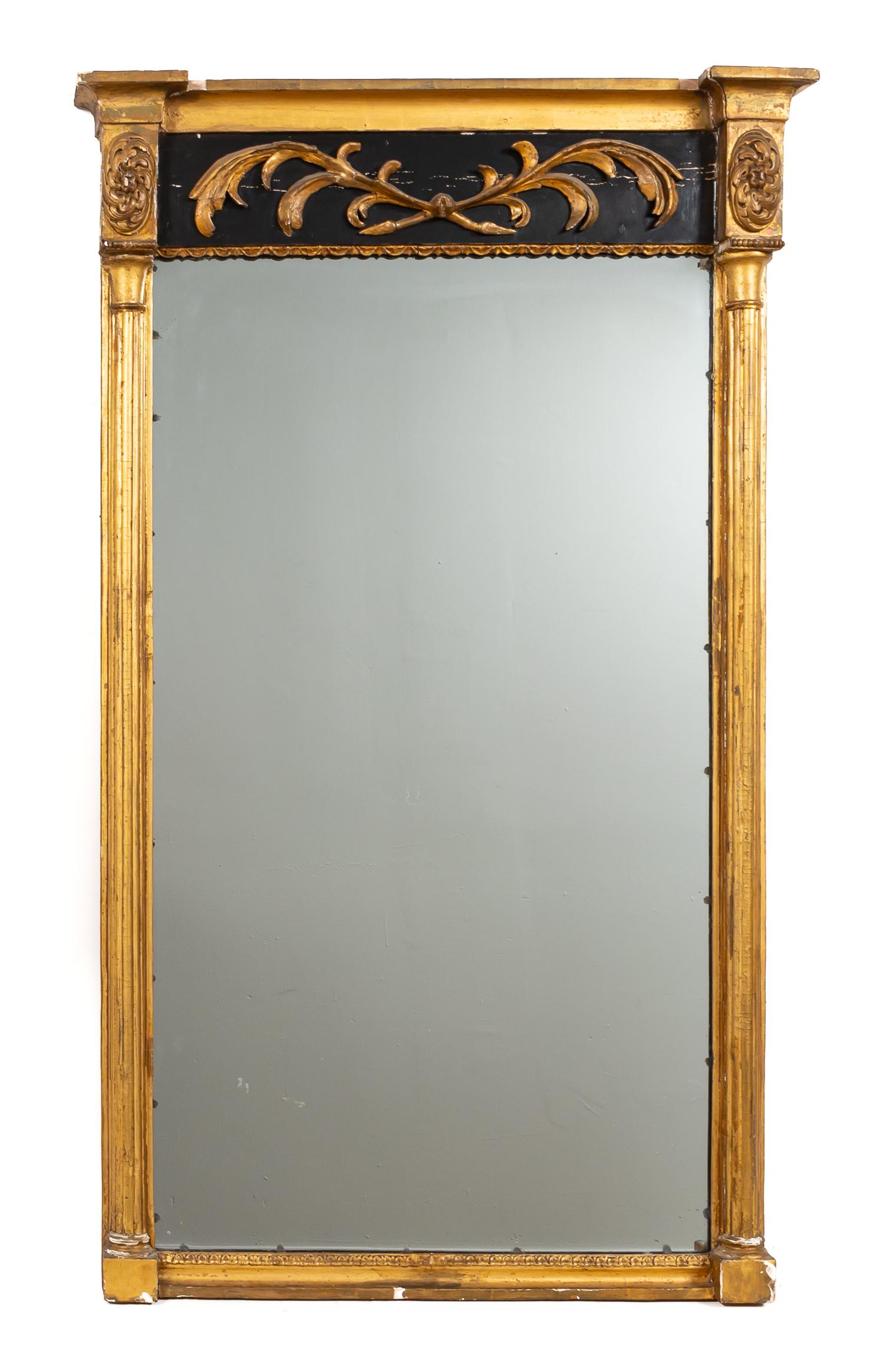 CONTINENTAL NEOCLASSICAL GILTWOOD PIER MIRROR: Continental, 19th century. Giltwood neoclassical pier mirror, stepped cornice above black painted frieze with attached carved and gilded branch. Approx. h. 56", w. 33"