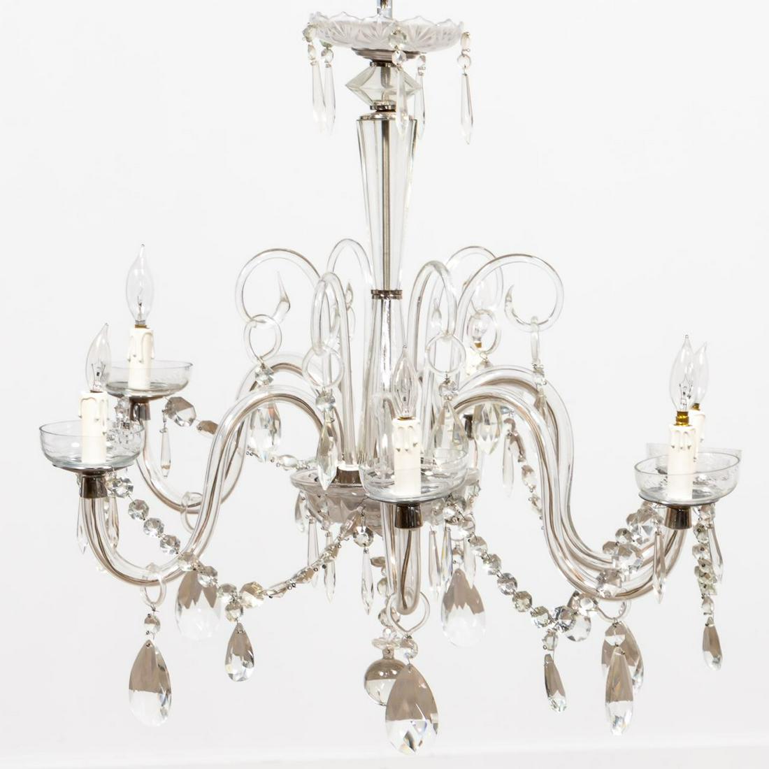 20TH C. CONTINENTAL CRYSTAL SIX-LIGHT CHANDELIER: Continental, last half 20th century. Mid-century style six-light colorless glass and crystal chandelier hung with swags and pendants, having a conical shaped stem with canopy above, and scrolled arms 