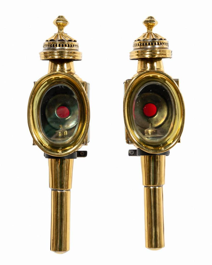 PAIR, CONTINENTAL BRASS CARRIAGE LAMPS: Continental, 19th century. Pair brass coach lamps with inset clear glass panels and red oculus. With mounting hardware. Approx. h. 17.5"