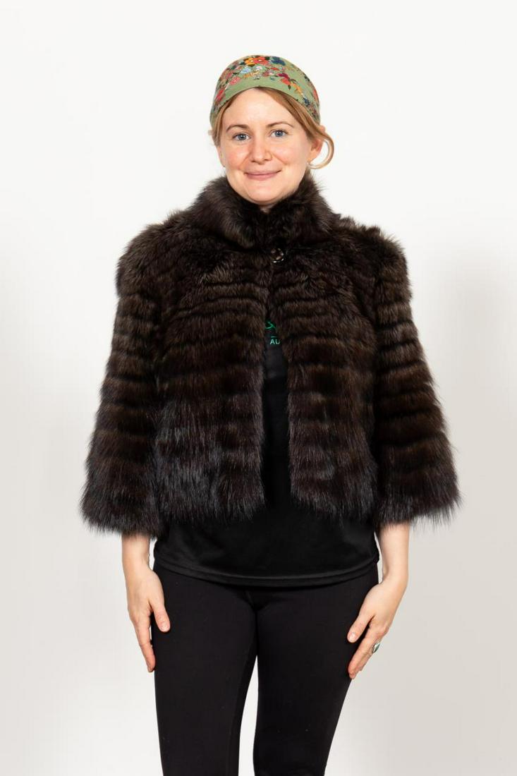LADIES CROPPED BROWN/BLACK FISHER FUR JACKET: Ladies cropped dyed brown/black fisher jacket having a single button. Label to the lining. Approx. flat measurements: shoulder 17", sleeve 15", bust 19", total length 21".