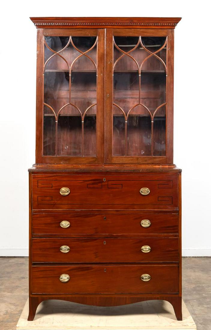 GEORGIAN STYLE MAHOGANY SECRETARY & CABINET: English, late 19th / early 20th century. Georgian style secretary and bookcase with gothic arched glass doors and Greek key inlay. Apparently unmarked. Approx. h. 85", w. 42", d. 20".