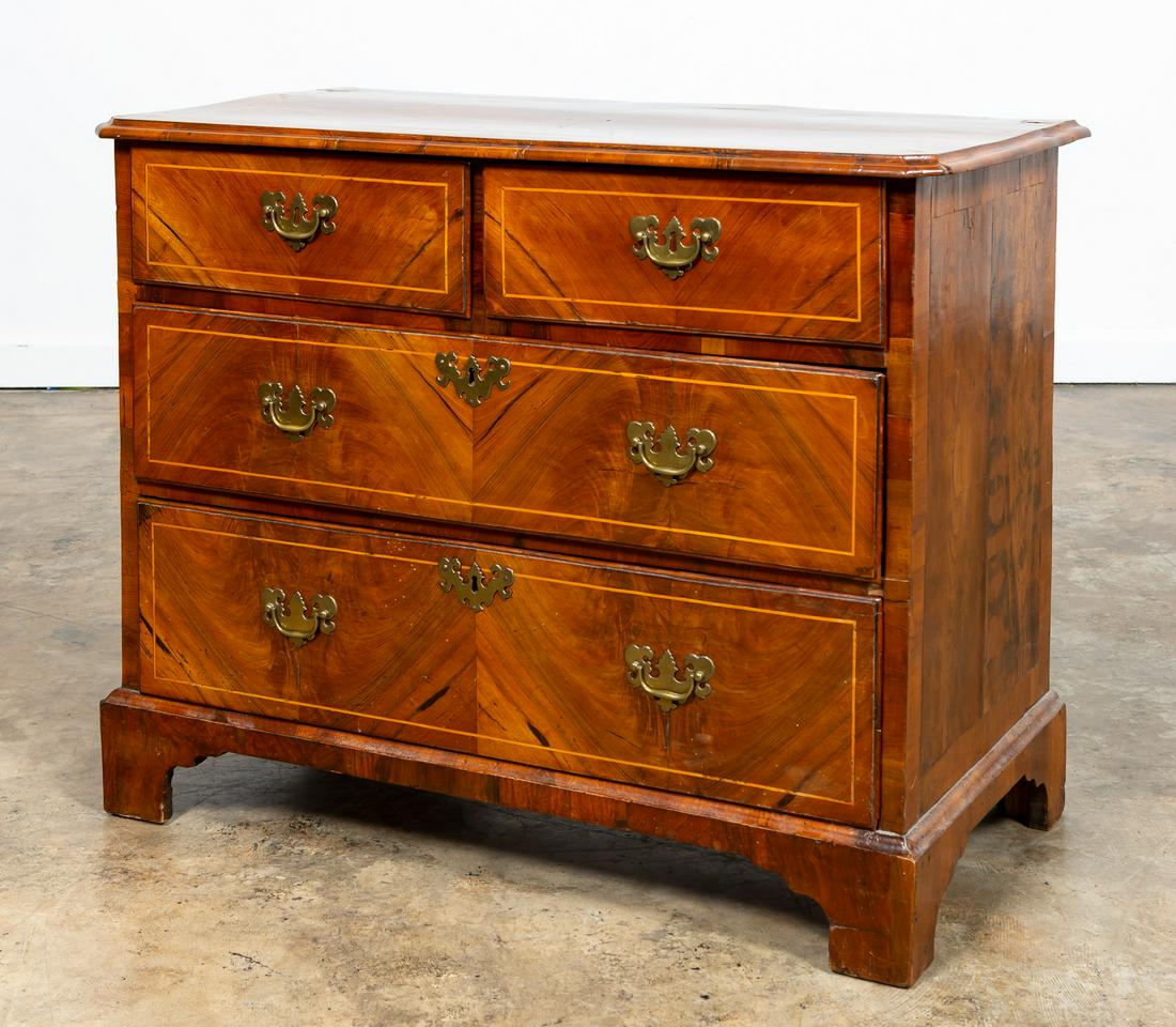 19TH C. ENGLISH CHIPPENDALE STYLE WALNUT CHEST: English, 19th century. Walnut chest in the Chippendale taste having four-drawers with brass hardware, geometric parquetry, and rising on bracket feet. Metal disc stamped 'E' to the back. Approx. h. 32