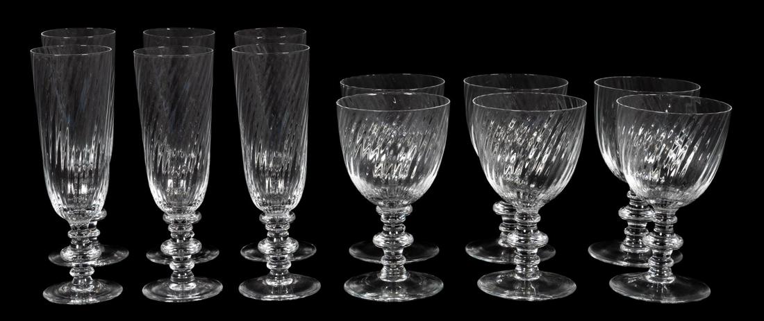 12 PCS, TIFFANY LUTECIA PATTERN WINE & CHAMPAGNE: Tiffany and Company, contemporary. Eight pieces "Lutecia" pattern crystal stemware comprising four champagne flutes (7") and four wine glasses (5.5"). Marked on foot.