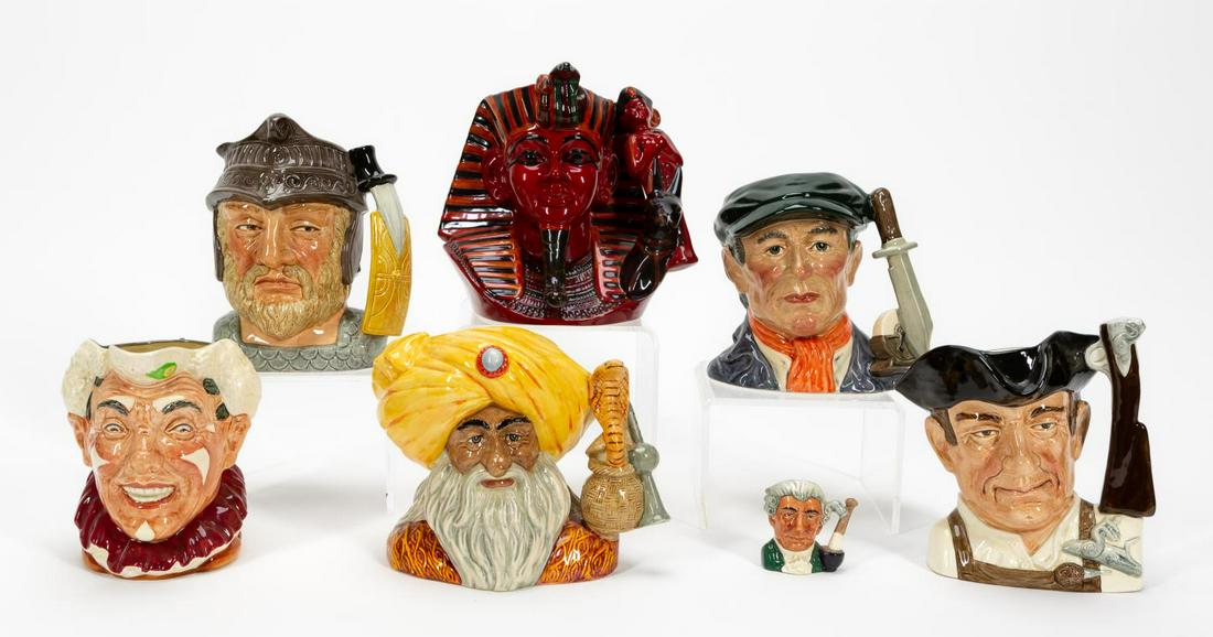 7 PCS, TOBY JUGS, WILLIAMSBURG, FLAMBE & OTHERS: Royal Doulton (British, founded 1815). Collection of seven ceramic toby character jugs comprising "Gunsmith", "Apothecary", "Clown", "Gladiator", "Snake Charmer", "Little Mester", and "Pharaoh (Flambe