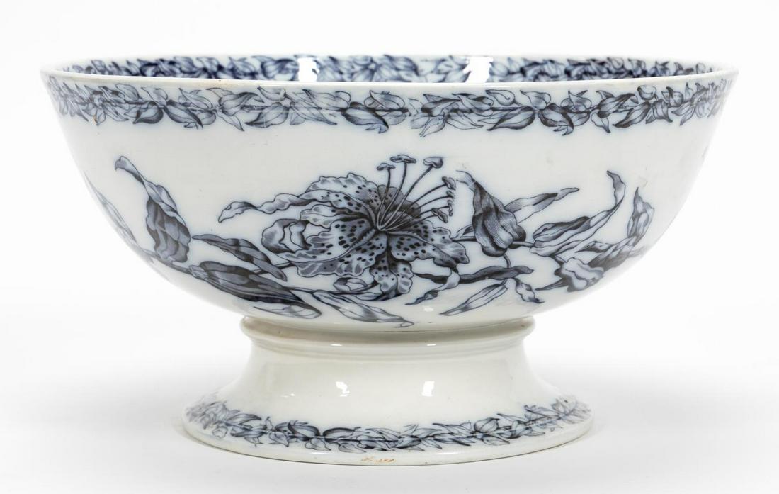 ENGLISH BLUE & WHITE FOOTED CERAMIC PUNCH BOWL: British, 19th century. English transferware, likely ironstone, footed punch bowl with foliate and tiger lily decoration in dark blue and white. Apparently unmarked. Approx. h. 7.75", dia. 14.5"