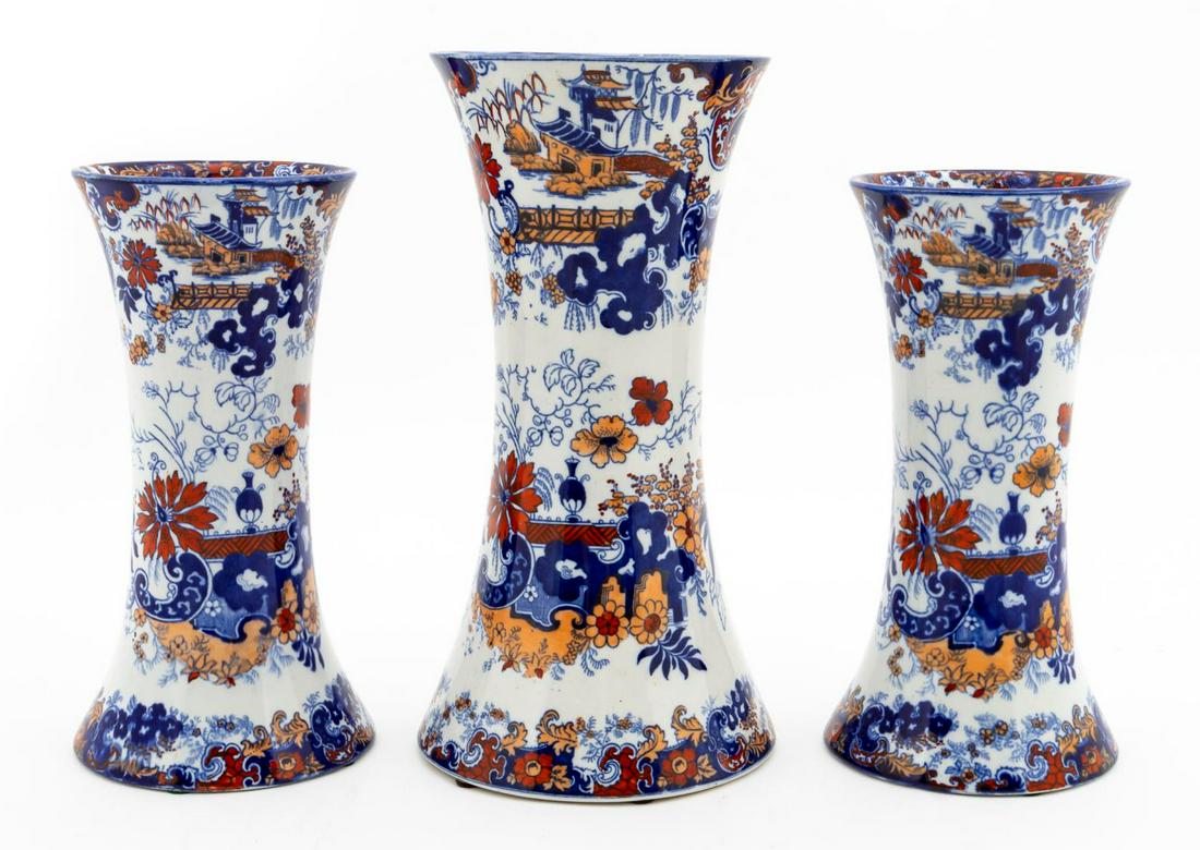 GROUP 3, RIDGWAY ‘CHINESE JAPAN' GARNITURE VASES: Ridgway (English, 1792-1940s), circa 1900. Group of three 'Chinese Japan' or 'Corey Hill' patterned beaker form earthenware garniture vases having blue transfer chinoiserie decoration with red and pea