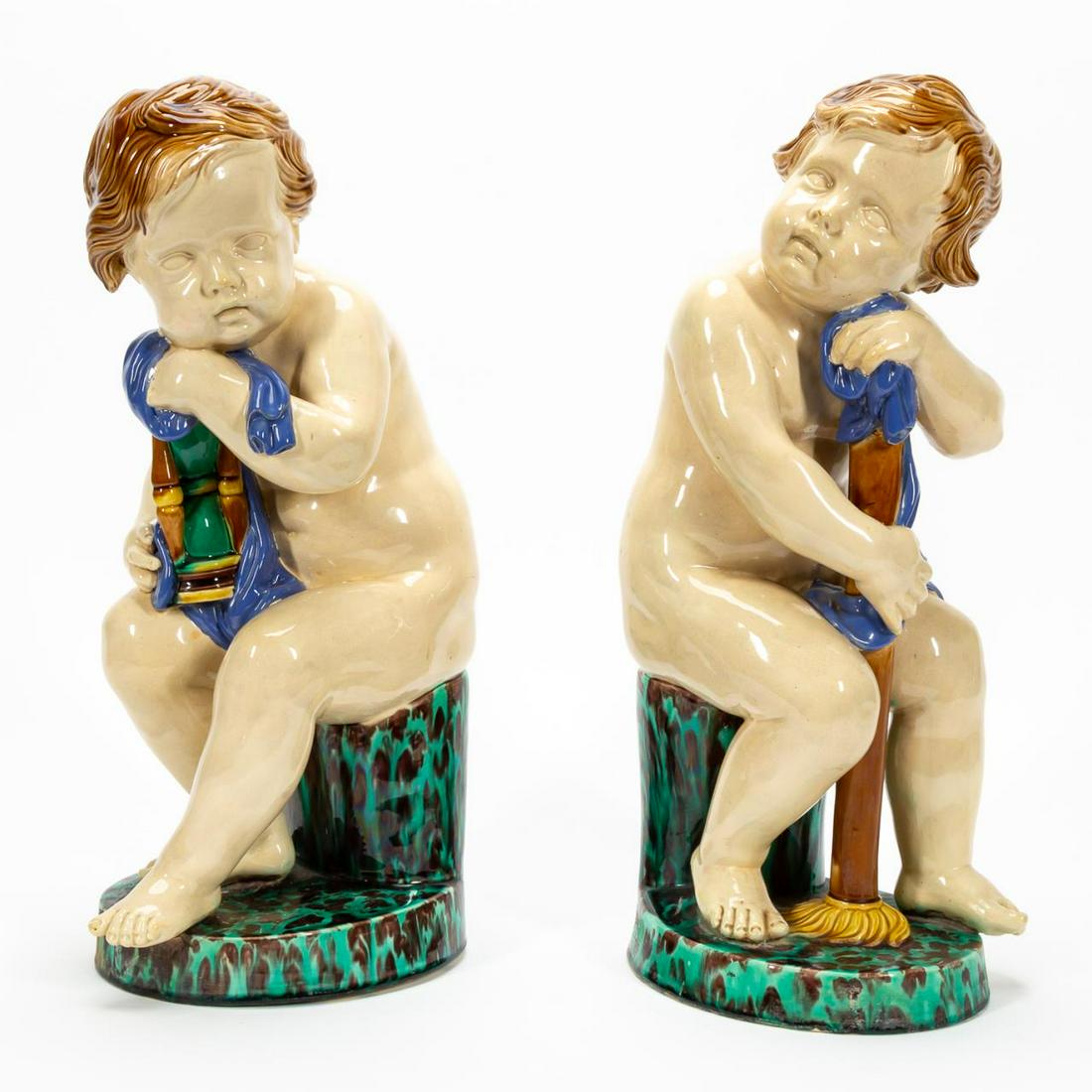 PR, MINTON TALL FIGURAL MAJOLICA CHERUB SCULPTURES: Minton (English), 1842. Large majolica seated cherubs on pillars. Marked to underside, having date and letter marks. Note: Accompanied by Susan West Pallant restoration report from January 2000. Appro