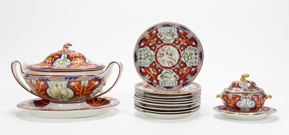 13 PCS, ENGLISH PORCELAIN DINNER SERVICE: British, 19th century. Thirteen pieces porcelain dinnerware in Imari-palette pattern comprising six unmarked plates (9.25"), three gold rimmed plates (two with painted blue circle marks) (9.5"), lidde