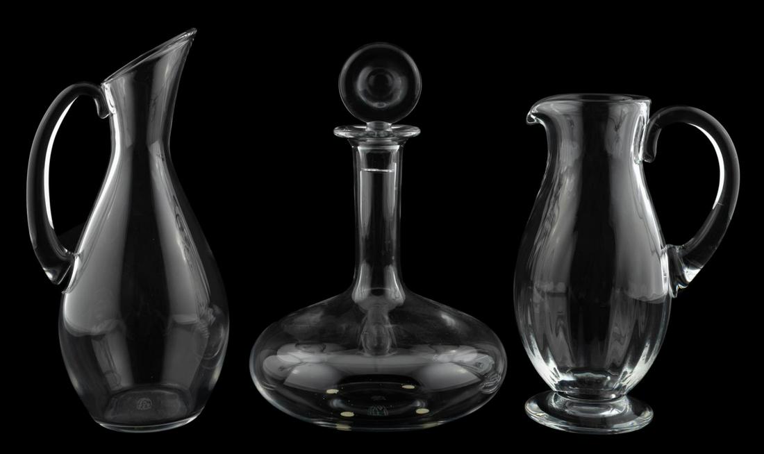 3 PCS, BACCARAT, BARWARE, DECANTER & PITCHERS: French, contemporary. Collection of crystal barware comprising "Oenology" ships decanter (11"), "Dom Perignon" pitcher (11.25"), and pitcher with swirl (9.5"), All appropriately marked underneath