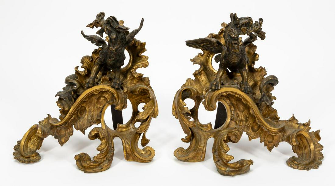 PAIR, FRENCH DRAGON MOTIF GILT METAL CHENETS: Continental, probably French, 19th/early 20th century. Pair of gilt metal chenets depicting fire breathing dragons or gryphons. Apparently unmarked. Approx. h. 14" w. 14" d. 9"