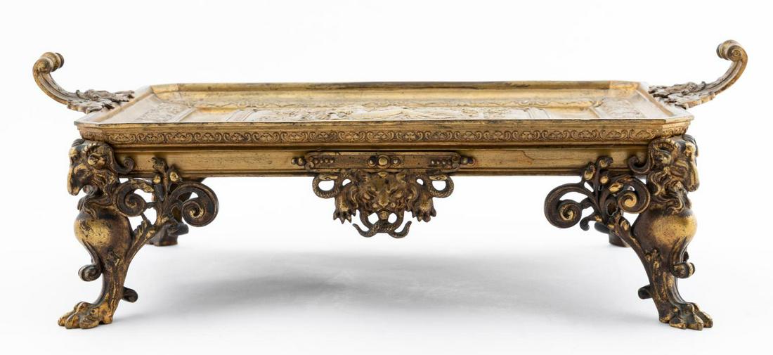 19TH C. DIANA AND THE STAG FOOTED BRONZE TRAY: French, last half 19th century. Victorian era gilt bronze tray having scrolled handles with masks, central panel depicting the myth of Diana and the stag, rising on ram form legs with hoof feet. Stamp