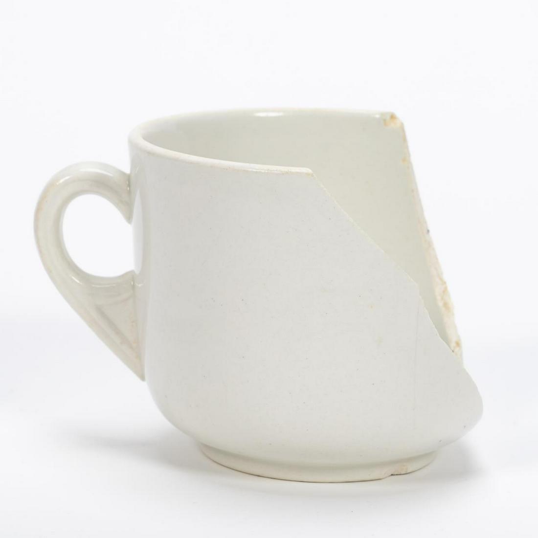 RMS CARPATHIA, SALVAGED PARTIAL THIRD CLASS CUP: RMS Carpathia, Cunard Line, maiden voyage May 5, 1903; sunk July 15, 1918. Salvaged partial white Mintons third class pottery cup. This type of cup was also used on the RMS Lusitania's and RMS Maureta