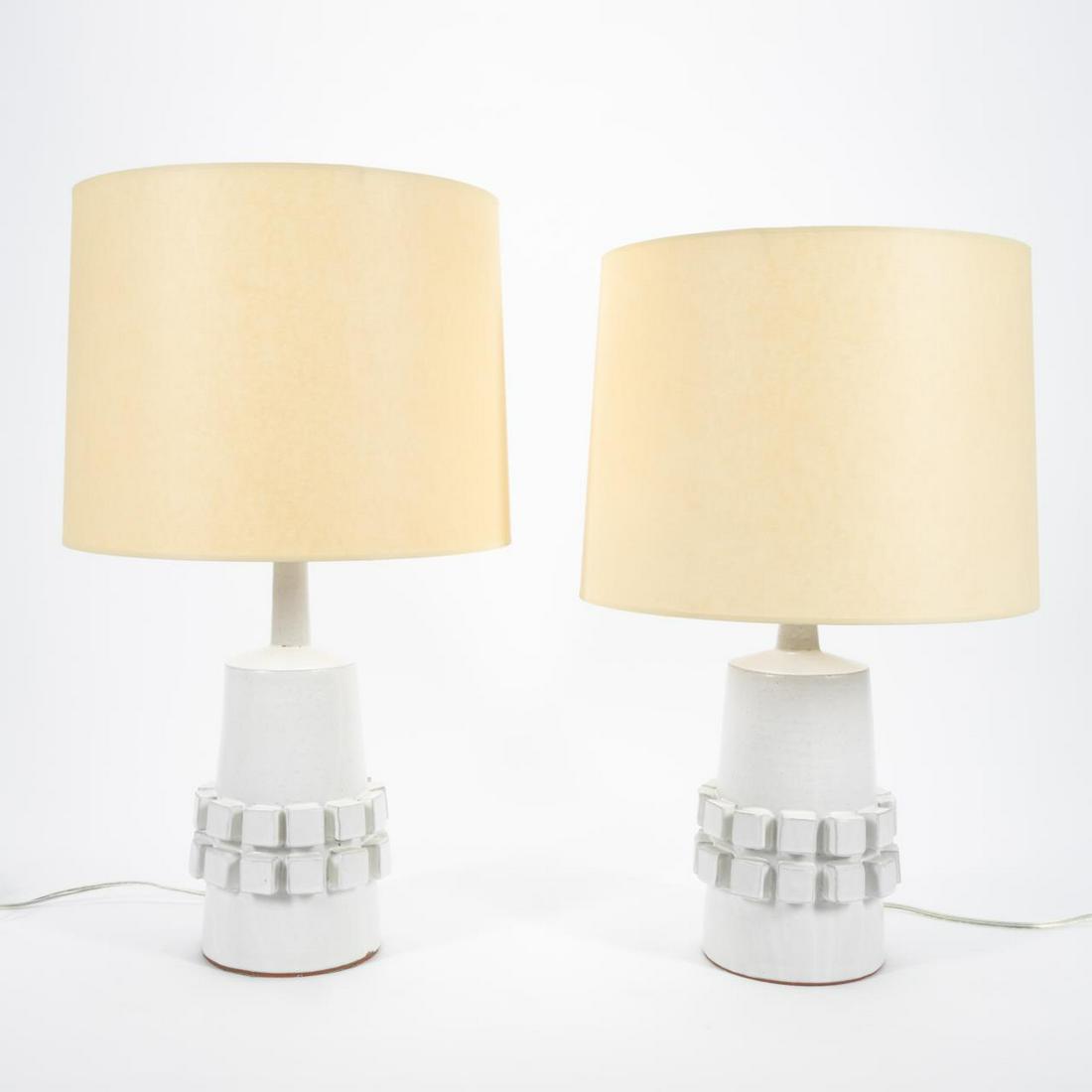 PAIR, JONATHAN ADLER WHITE POTTERY TABLE LAMPS: Jonathan Adler (American, b. 1966), contemporary. Pair of white glazed conical form lamps, each having a double row of radiating cubes. Unmarked. Approx. overall of one including the shade, h. 26.25,