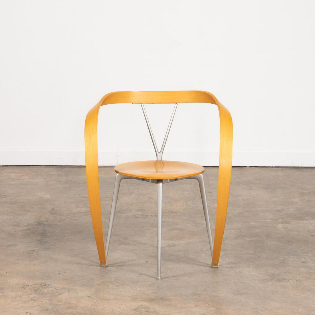 ITALIAN MODERN "REVERS" ARMCHAIR BY CASSINA: Andrea Branzi for Cassina (Italian), circa 1993. "Revers" 952 arm chair having sculptural from in beech plywood and aluminum. Maker's mark to underside. Approx. h. 29.625", w 24.5", d 17.125", seat h.