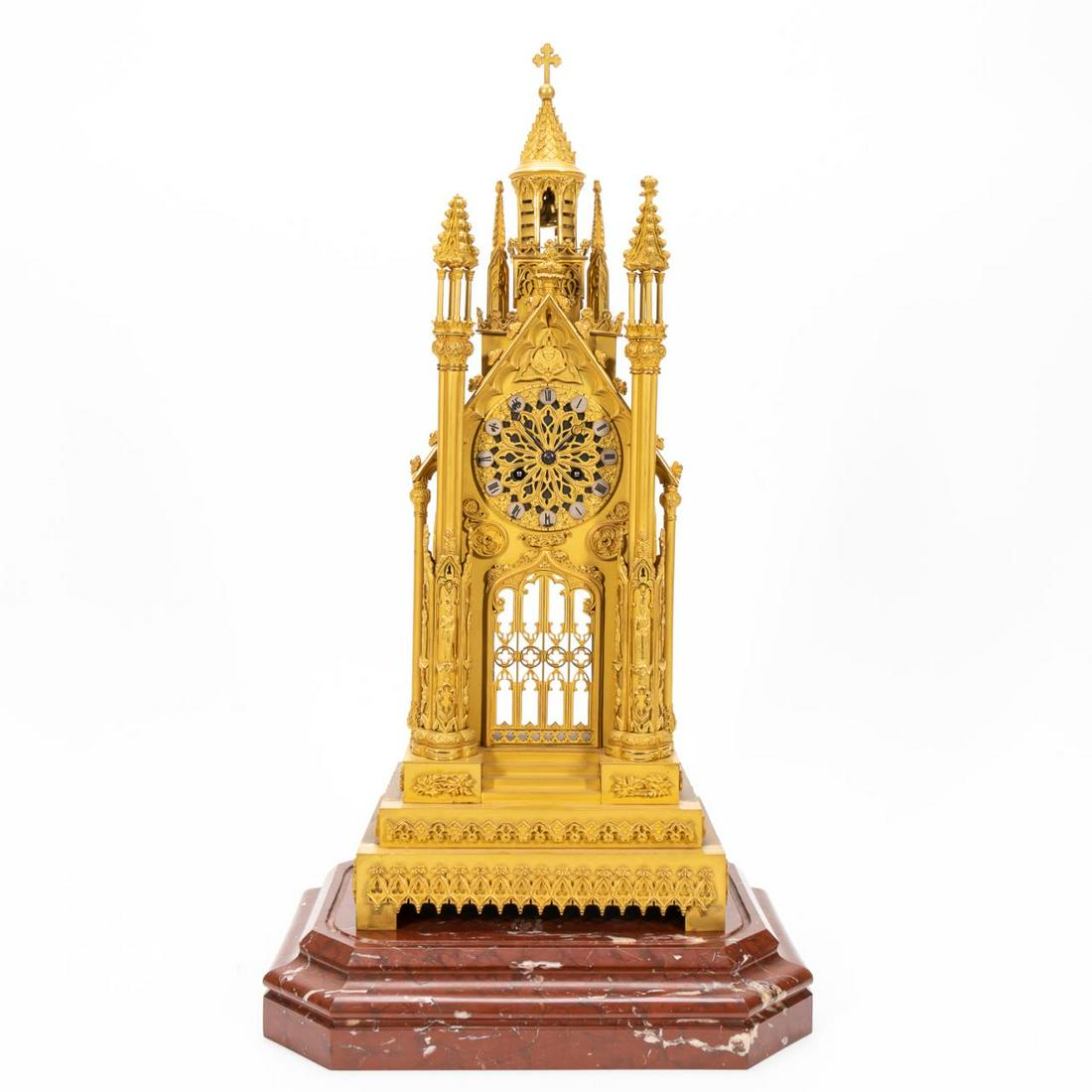 19TH C. FRENCH GILDED BRONZE CATHEDRAL CLOCK: French, 19th century. Manner of Bavozet Freres et Soeur, (Paris, founded 1823), gilt bronze cathedral-form clock in the gothic taste, on a rouge marble base. Mechanism stamped 'Etablissement/Petit'. P