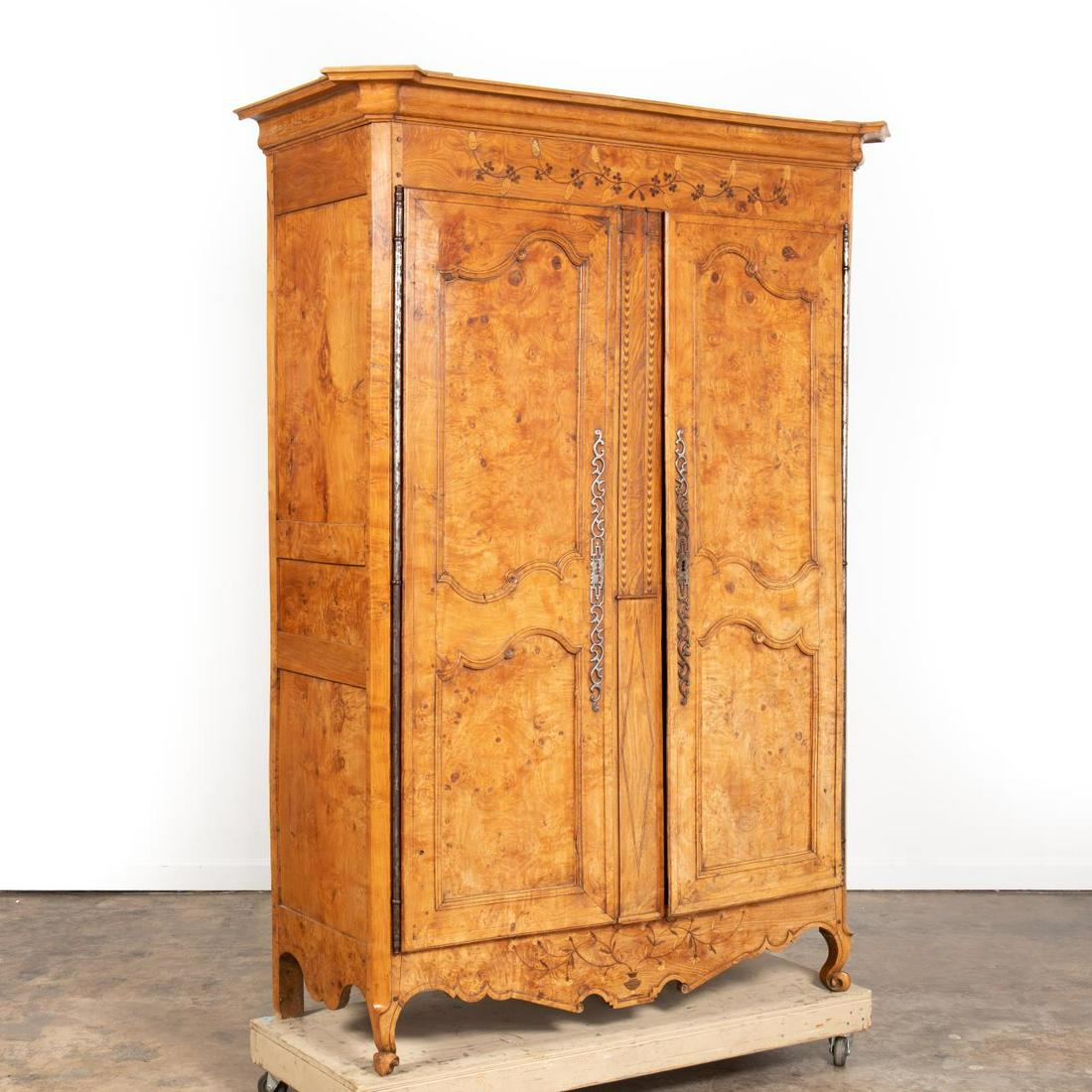 19TH C. LOUIS XV STYLE INLAID BURLWOOD ARMOIRE: French, 19th century. Burl walnut armoire in the Louis XV taste having a shaped cornice, floral marquetry inlay, paneled doors and sides, and rising on scrolled feet. Unmarked. Approx. h. 89", w. 58",