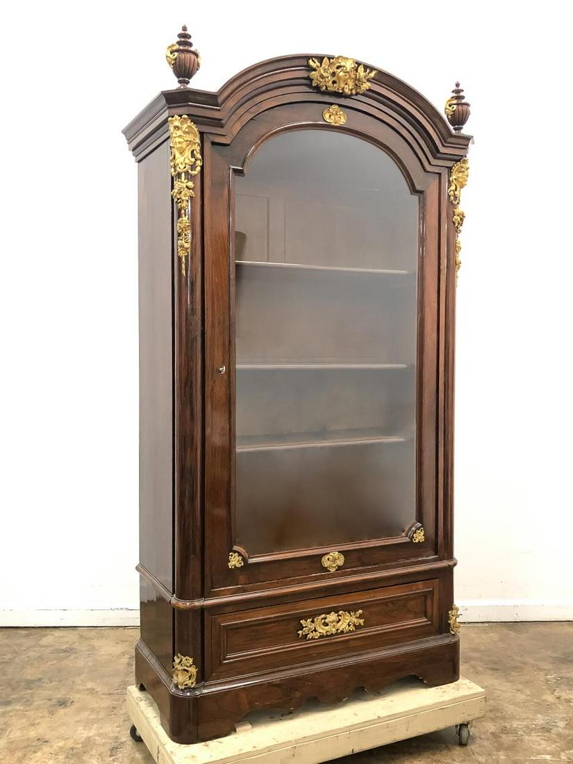 MONUMENTAL 19TH C. FRENCH LOUIS XVI STYLE CABINET: French, 19th century. Monumental Louis XVI style mahogany display cabinet with dore bronze ormolu and large glass door front. Christies label affixed to verso. Note: one key present for door, key for 