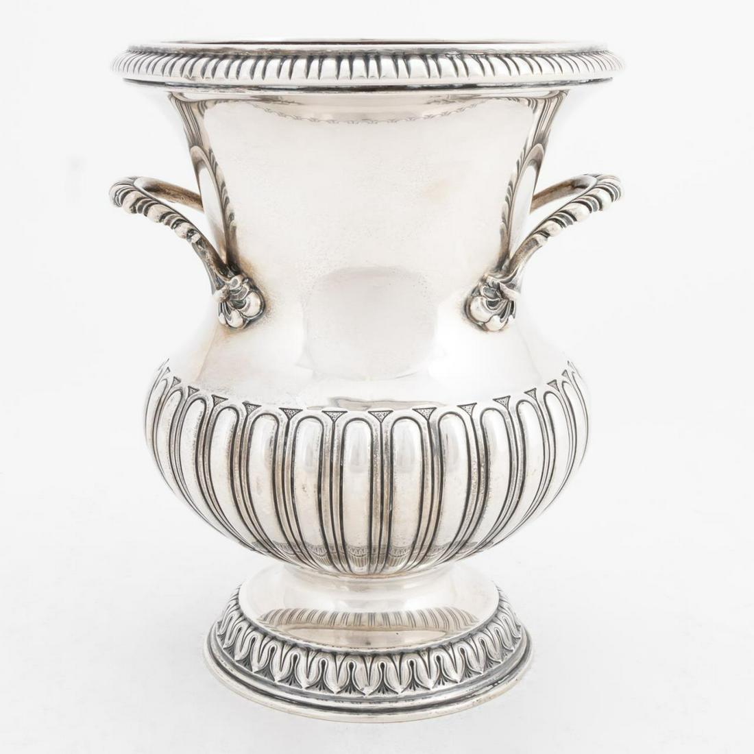 ILARIO PRADELLA, BUCCELLATI STERLING WINE COOLER: Ilario Pradella Company retailed by Mario Buccellati, circa 1955. Urn shaped handled sterling silver wine or champagne chiller. Appropriately marked. Approx. h. 9.5", dia at rim 7.5". 44.89 ozt. Item