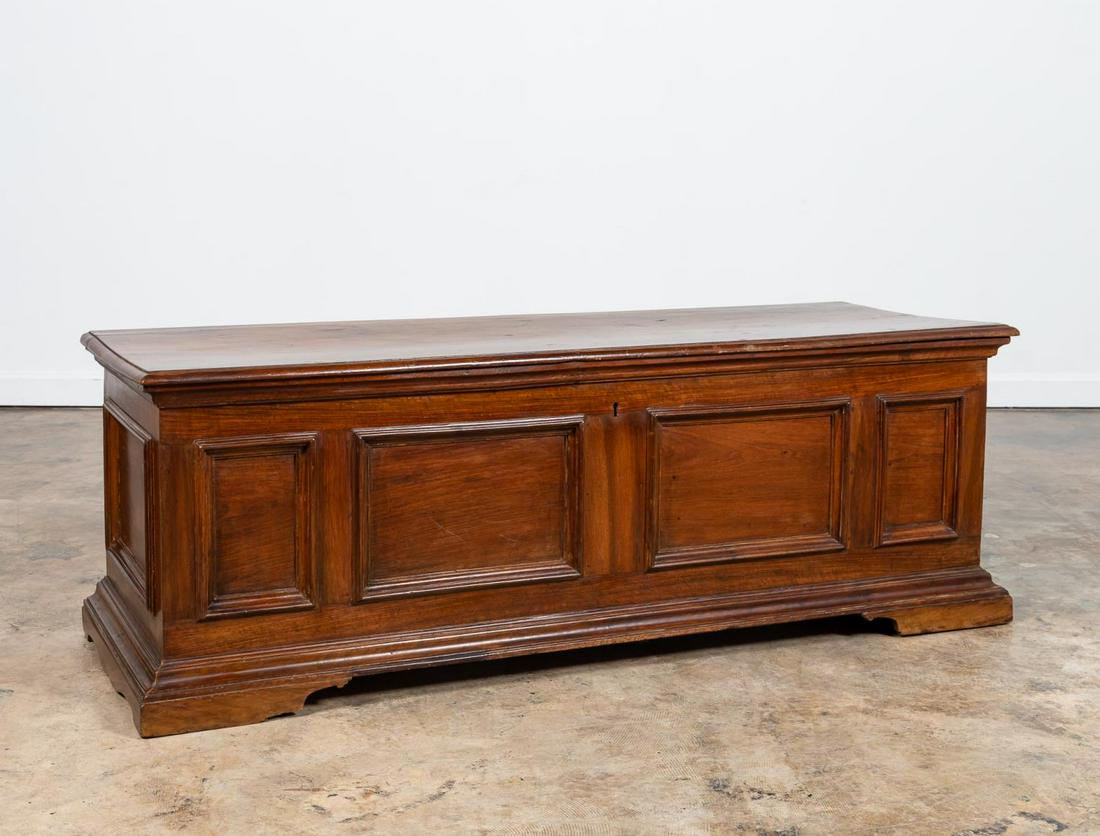 18TH C. ITALIAN BAROQUE STYLE WALNUT CASSAPANCA: Italian, 18th century. Large Tuscan walnut cassapanca or chest in the baroque taste, having a hinged lid, single interior compartment, applied paneled sides, and rising on bracket feet. Unmarked. Note