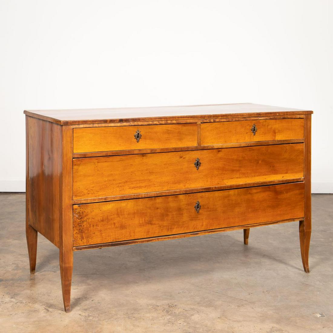 18TH C. ITALIAN NEOCLASSICAL FOUR-DRAWER COMMODE: Italian, late 18th to early 19th century. Transitional rococo-neoclassical fruitwood commode or chest having four-drawers and rising on slight cabriole legs. Unmarked. Provenance: From the Estate of M