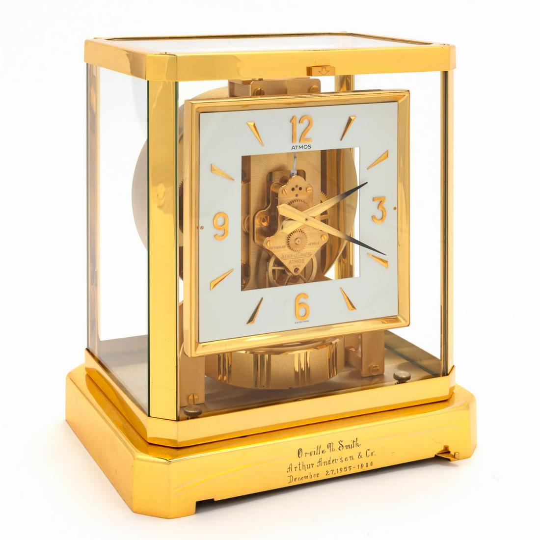 JAEGER LECOULTRE "ATMOS" SQUARE DIAL BRASS CLOCK: Jaeger LeCoultre (Swiss). Atmos clock with brass and glass case of rectangular form,squarer face with white ring and brass markers and arabic numerals. Maker's marks to works, 15 jewels,and 518858 to 