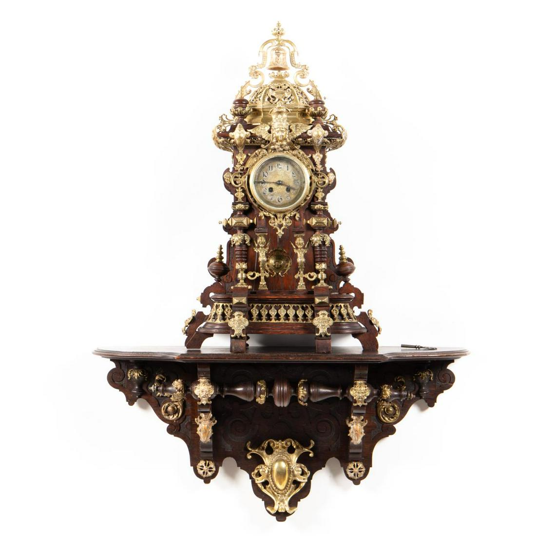ORNATE LENZKIRCH BRACKET CLOCK & SHELF, 1890-1895: Lenzkirch (German, 1850-1932), 1890-1895. Ornate architectural form bracket clock and shelf, having a walnut case, both heavily adorned with figural and foliate brass elements. Serial number 787768 an