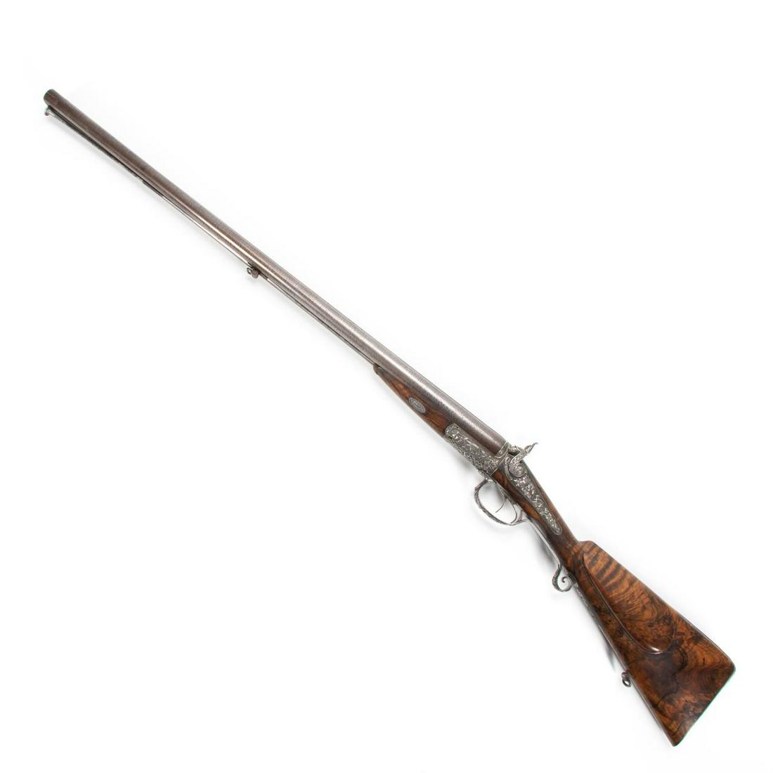 14-BORE D.B. BERINGER DOUBLE BARREL HAMMERGUN: D. B. Beringer (French), first half 19th century. 14- bore patent reverse rotary underlever double barrel hammergun with browned twist iron sighted barrels ,and low relief hunting themed silver mounts
