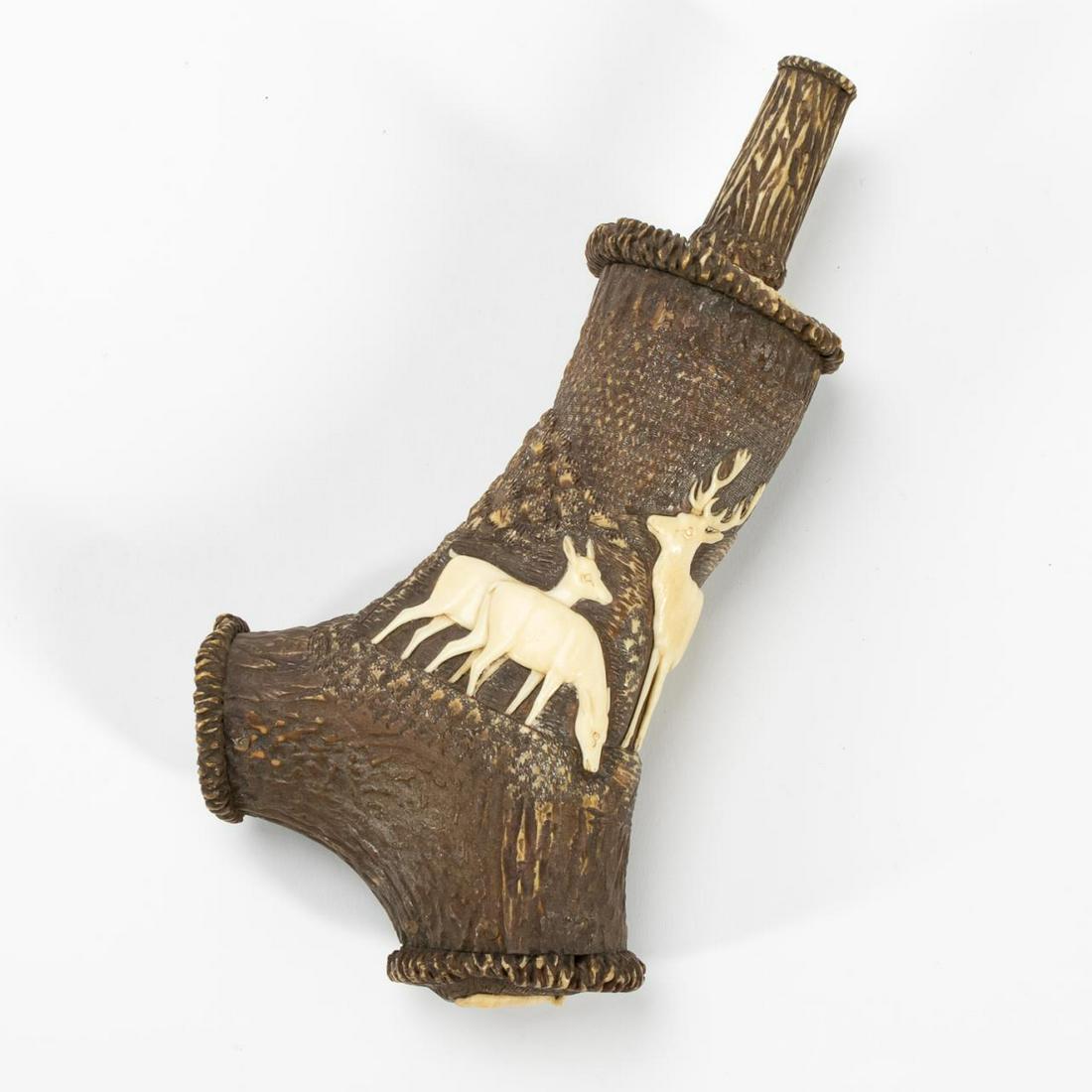 LEBRECHT SCHULZ HUNTER'S DEER HORN POWDER FLASK: Attributed to Lebrecht Wilhelm Schulz (German, 1774-1864), circa 1830-1840. Hunter's deer horn powder flask having animal motif. Unmarked. Provenance: Hermann Historica on May 27, 2020, lot 3172. Appr