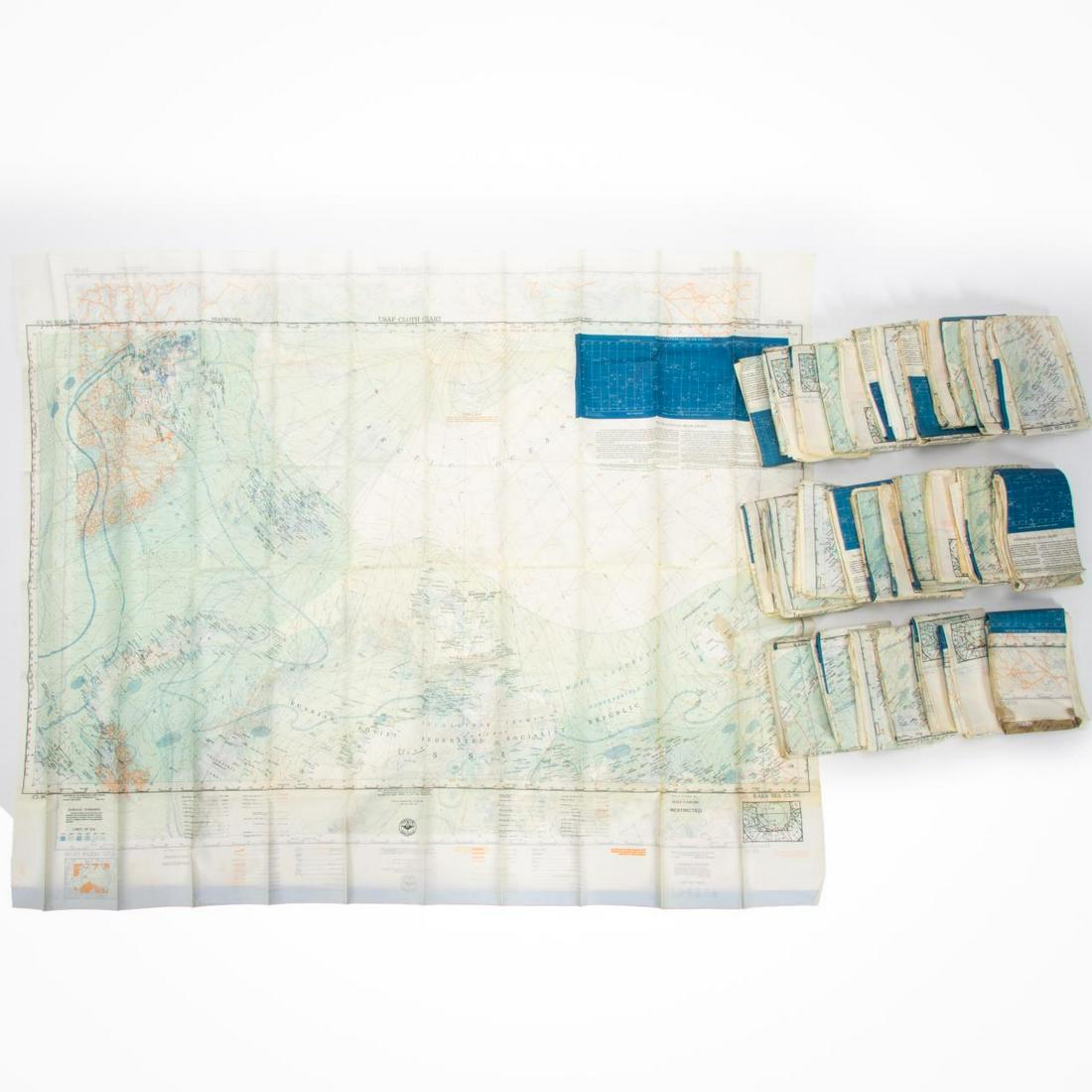 33 PCS, U.S. MILITARY ISSUE COLD WAR SURVIVAL MAPS: U.S. Government, 1950. Collection of thirty-three armed services CL 98 and 99 survival maps of the Kara Sea and Arctic Ocean, printed on fabric. Approx. 33" x 43" (each) Item from the Estate of Forest