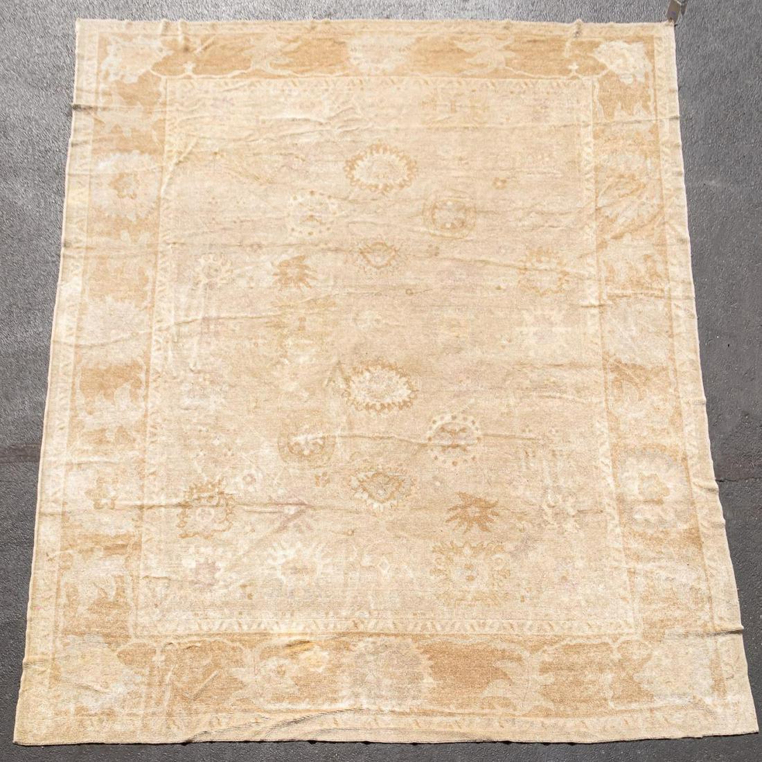 OUSHAK HANDWOVEN WOOL CARPET, 12' 4" x 15': Turkish. Oushak handwoven wool rug. Provenance: From the private collection of Mrs. Cara Isdell Lee, daughter of Coca-Cola CEO and Chairman (2004-2009), E. Neville Isdell, of Atlanta, Georgia. Approx.