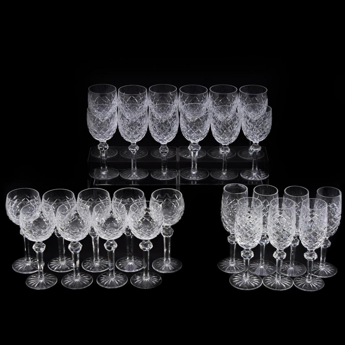 WATERFORD CRYSTAL ‘POWERSCOURT’ STEMWARE, 28PC: Waterford Crystal (Irish, founded 1783), 20th century. Group of twenty-eight pieces of colorless leaded cut glass 'Powerscourt' (active 1969-2017) comprising twelve goblets, seven champagne flutes and