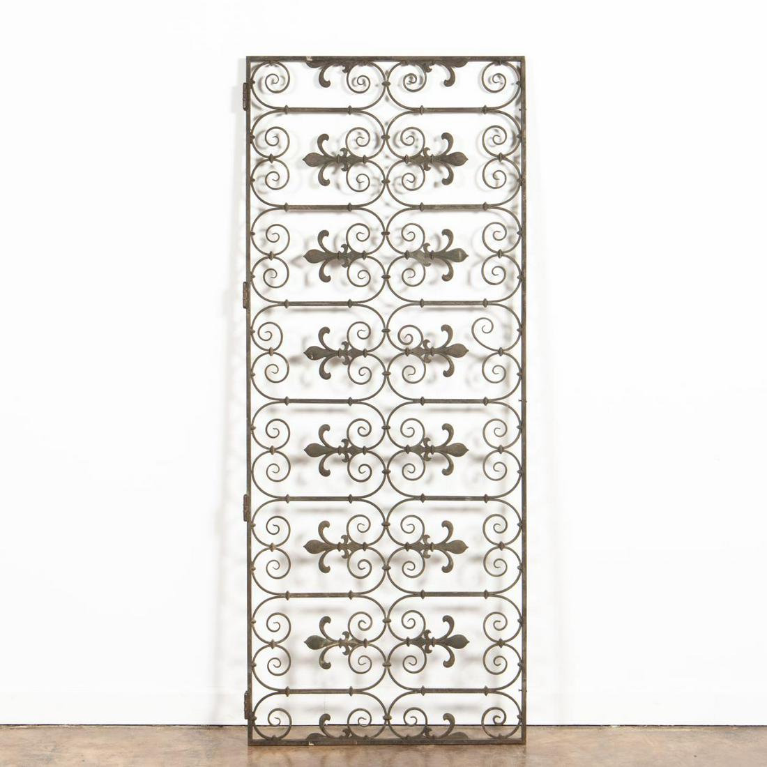 E. 20TH C. BEAUX ARTS BRONZE POST OFFICE DOOR: American, early 20th century. Bronze beaux arts post office door, having a scrolled fleur de lis pattern and hinges. Unmarked. Approx. h. 75.75", w. 31", d. 1". Item from the Estate of Forest "Tag" Hu