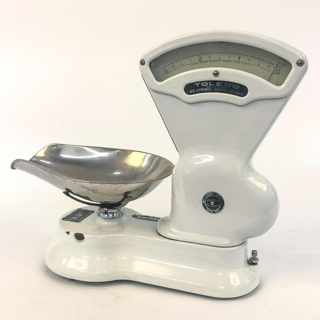 TOLEDO SCALE NO.405CA COUNTERTOP CANDY SCALE: Toledo Scales or Mettler Toledo (American, founded 1901), early 20th century. A model 405CA one cent countertop candy scale with white enamel surface. Marked with applied tag having serial number "580