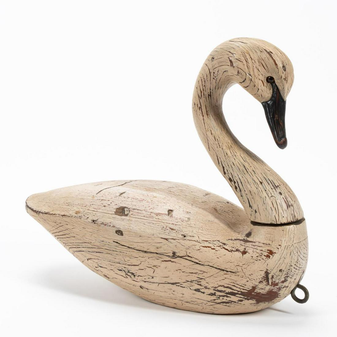 CONTEMPORARY WHITE SWAN WOODEN DECOY: American, contemporary. Wooden swan decoy with partially swiveling neck. Impressed hunter's mark "LDS RIG". Provenance: Acquired from Leland Little on April 14, 2018, lot 198. Approx. w. 17.5" Item fr