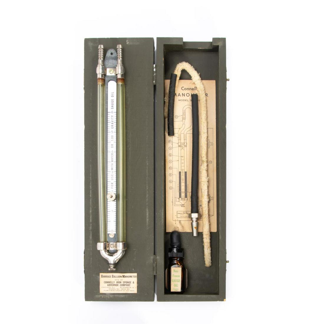 CONNELLY, BARRAGE BALLOON MANOMETER IN CASE: Connelly iron Sponge and Governor Company (American/Illinois, 20th century). Barrage Balloon Manometer in case, labeled. Approx. w. 13.5" (case) Item from the Estate of Forest "Tag" Hunter, Atlanta, G