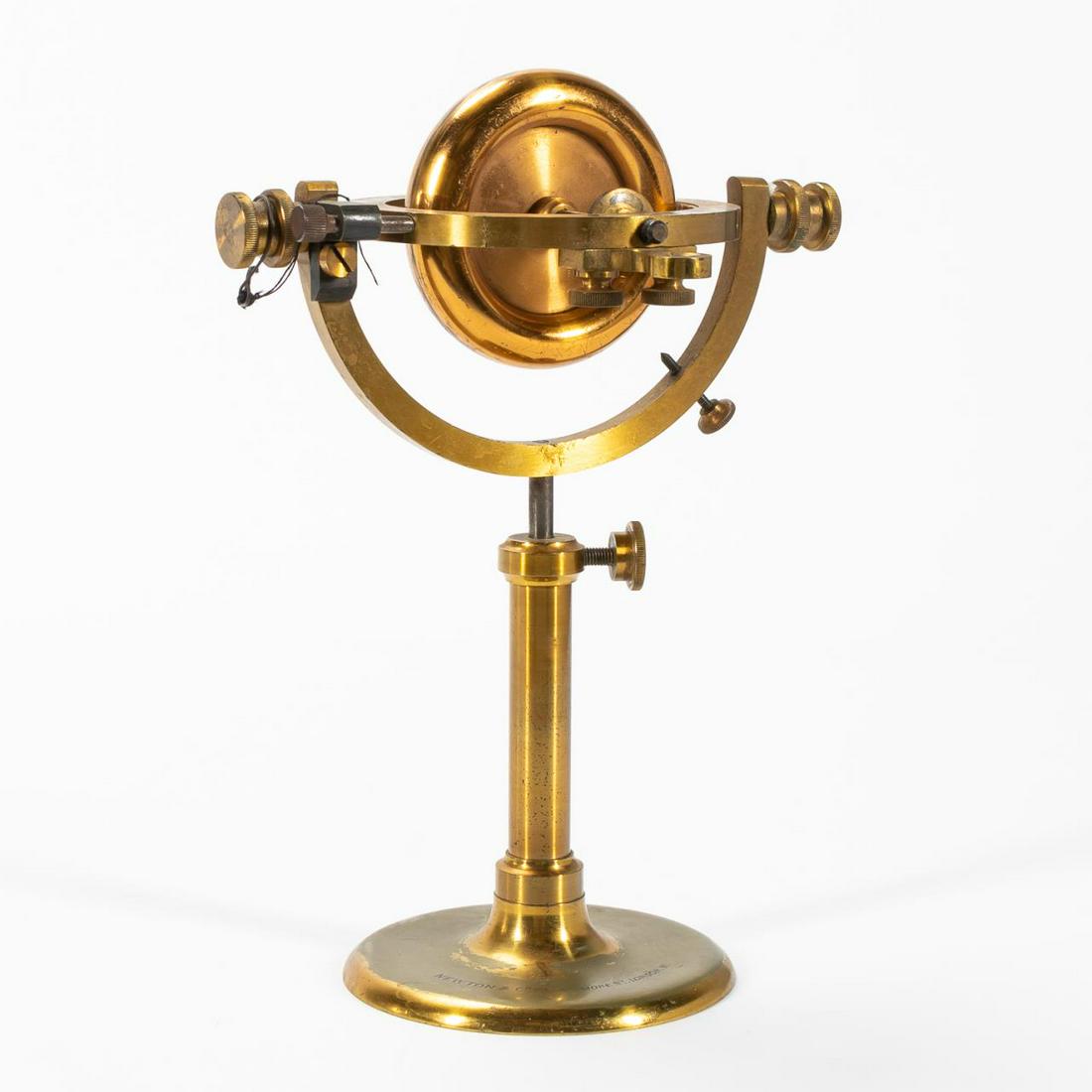 NEWTON & COMPANY, LONDON, BRASS GYROSCOPE: British, early 20th century. Newton and Company brass gyroscope, 3" flywheel with adjustable stand, marked on base with Wigmore St, London address. Provenance: Specialist Auctions Ltd, UK, Sep. 2018, 