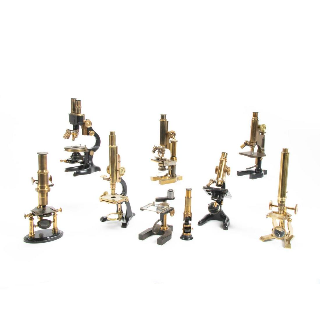GROUP OF NINE AMERICAN AND EUROPEAN MICROSCOPES: American and European, late 19th to early 20th century. Group of nine brass and iron binocular and monocular microscopes including: three Bausch & Lomb (American, founded 1853), serial numbers 17271 (