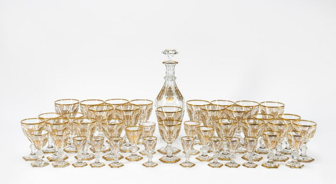 43 PCS BACCARAT "EMPIRE" GILT CRYSTAL STEMWARE SET: Baccarat (French), 20th century. Forty-three piece "Empire" (Introduced 1825, discontinued) gilt decorated glassware set, comprising of thirteen tall water goblets (h. 6.25"), thirteen wine (h. 5.25")