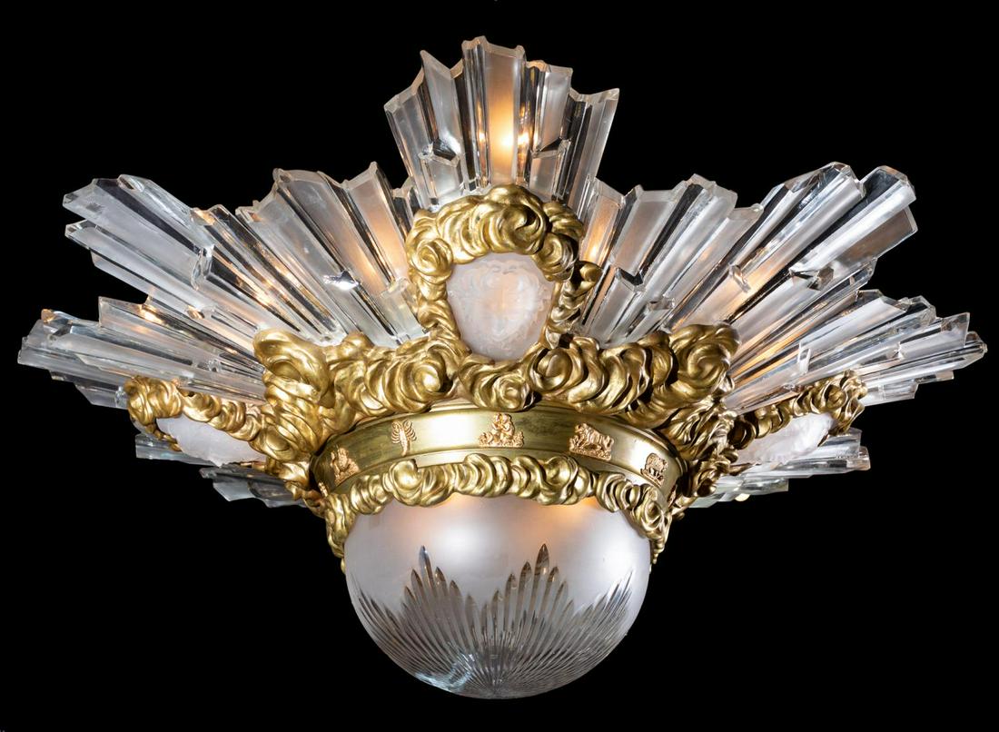 ART DECO 24-LIGHT GLASS & GILT BRONZE PENDANT: French, circa 1930. Art Deco twenty-four light gilt bronze and glass large pendant chandelier featuring a band with the 12 zodiac signs, frosted glass molded face accents and faceted radiating glass p