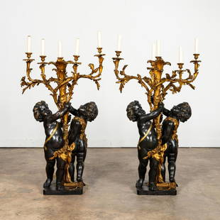 PAIR, GILT & PATINATED BRONZE CHERUB CANDELABRA: Maison Forest (French, founded 1883), circa 1900. Pair of large gilt and patinated bronze five-light candelabra in the Louis XV taste, each having two cherubs holding aloft a naturalistic scrolled bra