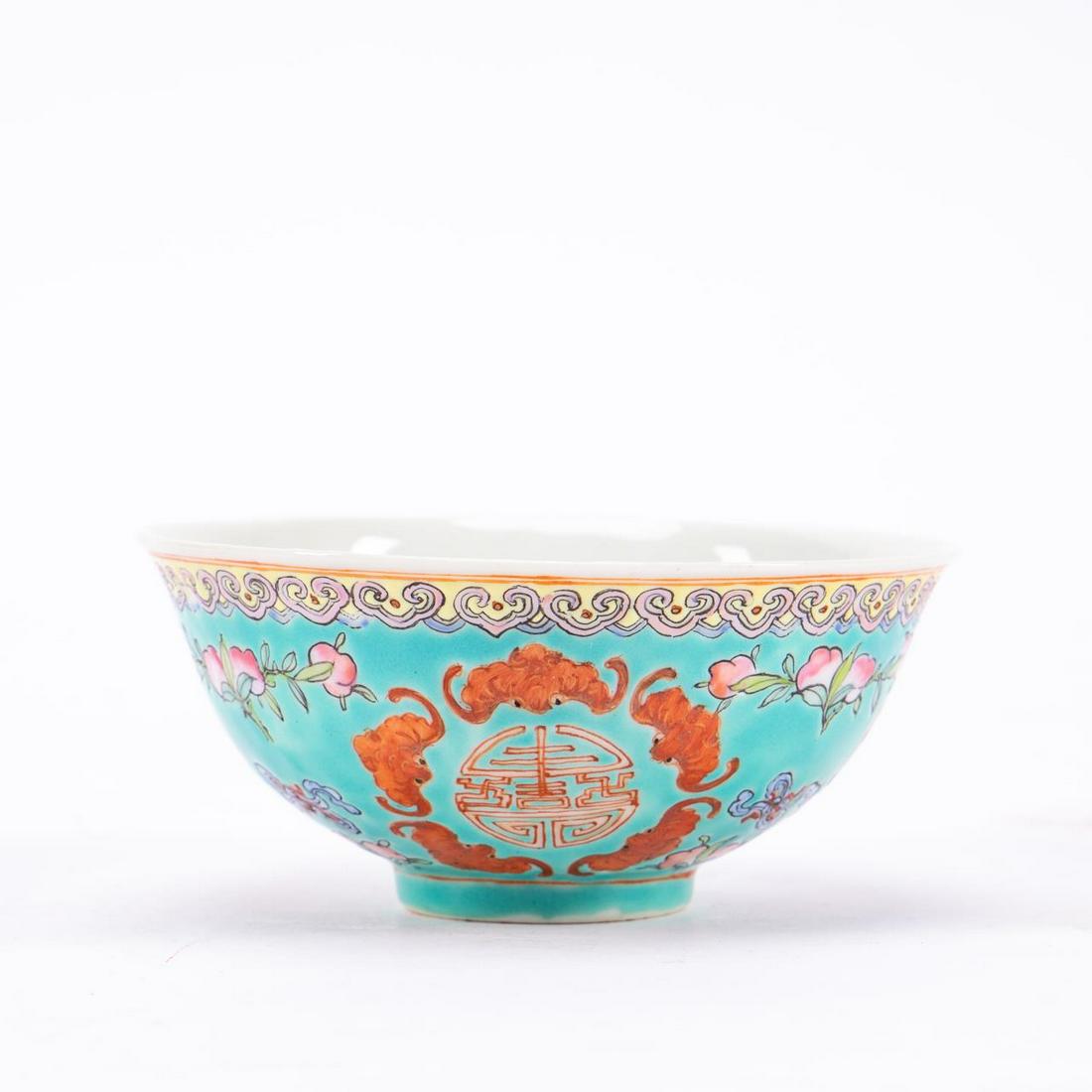 SMALL CHINESE PORCELAIN TURQUOISE RICE BOWL: Chinese. Small turquoise bat motif porcelain rice bowl. Four character mark to underside. Approx. h. 2", diam. 4.5".