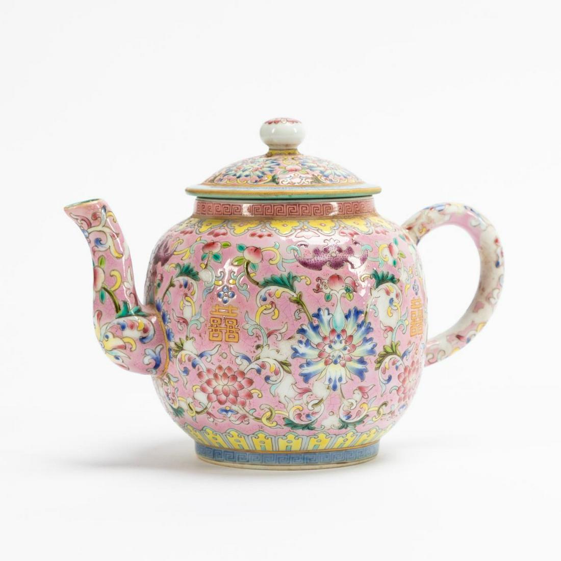 CHINESE PORCELAIN FAMILLE ROSE LIDDED TEAPOT: Chinese. Famille Rose lidded teapot having double happiness, bat, and floral motif. Marked to underside, Qianlong mark. Approx. h. 5.5" (top of lid).