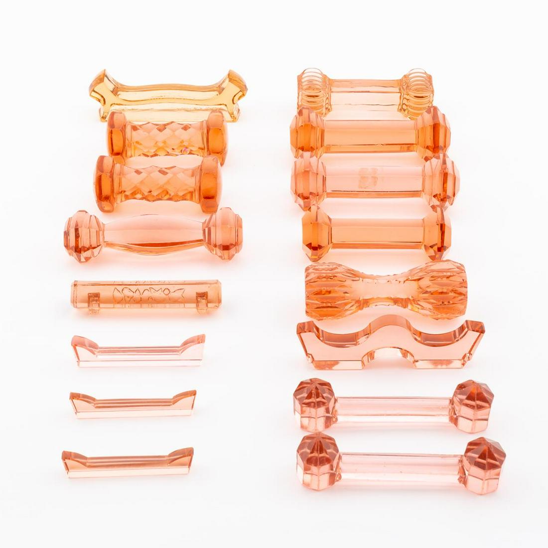 16 SALMON COLORED MISC. GLASS KNIFE RESTS (1 of 6)